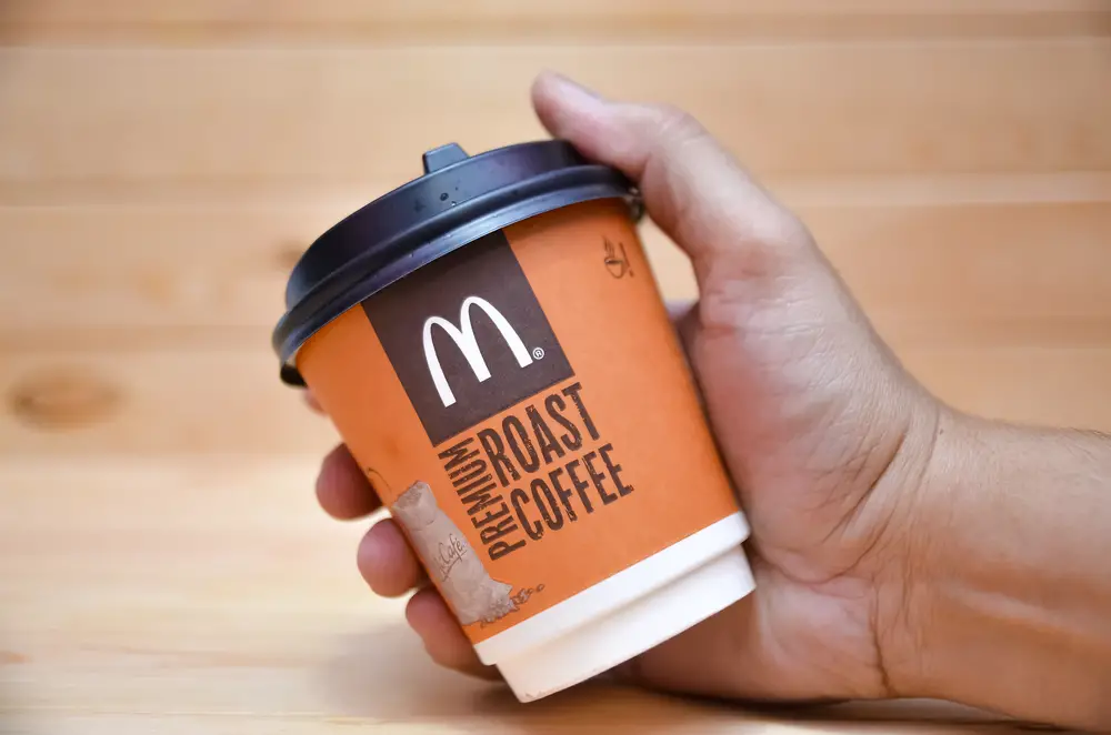 Hand-holding-small-McDonalds-coffee-cup